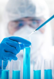Researchers scientist working analysis with blue liquid test tube in the laboratory, chemistry science or medical biology experiment technology, pharmacy development solution